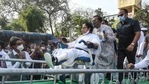 TMC leader Aroop Biswas pulls the wheelchair of WB CM and TMC Supremo Mamata Banerjee during 'Nandigram Diwas'rally at Hazra crossing from Gandhi Statue, in Kolkata(PTI)