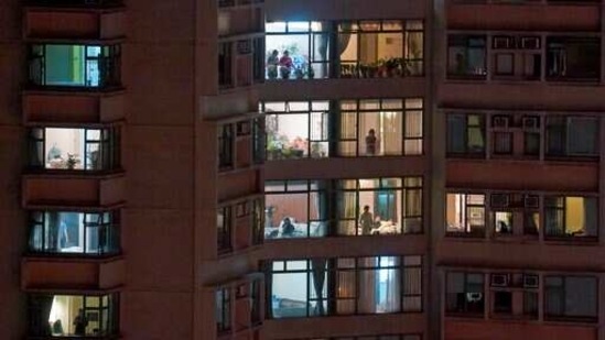 Residents stay in their homes in an apartment block at Robinson Road, in Hong Kong Island's Mid-Levels residential area. (AP) Residents stay in their homes in an apartment block at Robinson Road, in Hong Kong Island's Mid-Levels residential area. (AP)