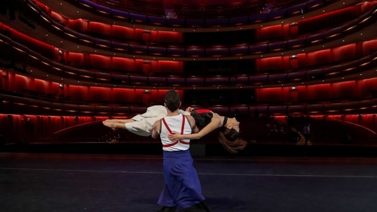 Elton Dimrochi holding Elpida Skourou, dancers of the Greek National Opera Ballet, perform during a rehearsal of 