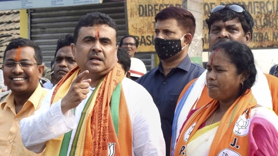 BJP leader Suvendu Adhikari arrives to file nomination from Nandigram ahead of the assembly polls, at Haldia in Purba Medinipur, on March 12. Adhikari on March 14, without naming anyone said those who had forgotten Nandigram for 12 years are now coming here to seek votes. The TMC observes March 14 as 'Nandigram Divas' to pay respect to the 14 people who were killed in police firing on this day during an anti-land acquisition stir in 2007.(PTI)
