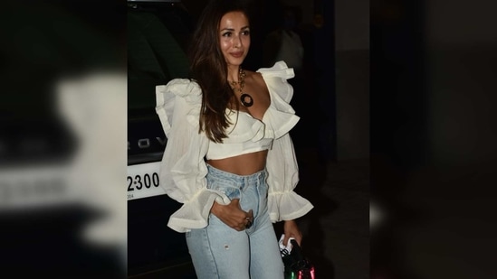 She teamed it with a pair of wide-legged distressed jeans while flaunting her washboard abs. (Varinder Chawla)