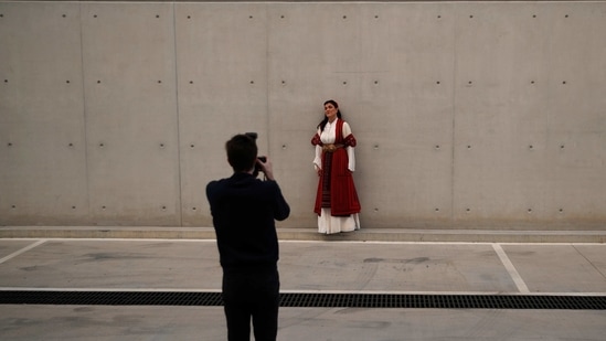 Greek soprano Artemis Bogri poses for the photographer Andreas Simopoulos before a rehearsal of "Despo-Greek Dances" Opera and dance performance in Athens, Thursday, March 4, 2021. (AP)