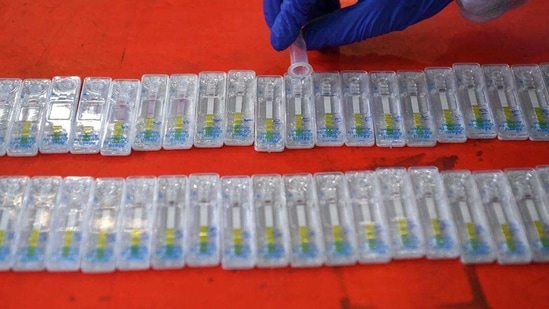 A health worker conducts a RT-PCR Covid-19 coronavirus test from nasal swab samples. 