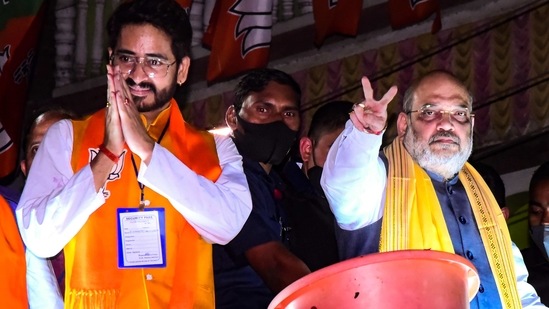 Union home minister Amit Shah with actor and party candidate for Kharagpur seat Hiran Chatterjee during an election rally ahead of the crucial West Bengal assembly polls at Kharagpur in West Midnapore district on Sunday. (PTI PHOTO)