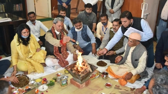 New CM Tirath Singh Rawat participating in hawan ceremony before taking charge of his office at the secretariat here on Sunday.(HT Photo)