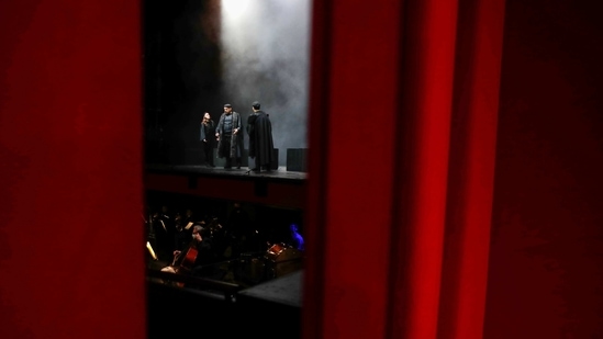 Singers and the orchestra of the Greek National Opera perform during the video recording of "Despo-Greek Dances" Opera and dance performance in Athens, Saturday, March 6, 2021. Dozens of museum exhibitions, theater productions, discussion panels and historical re-enactments were planned in Greece for this year to commemorate the bicentennial of the 1821-1832 Greek War of Independence. But due to the coronavirus pandemic, mezzo-soprano Artemis Bogri and her fellow singers stepped onstage in an empty theater to perform the Greek National Opera’s new production of “Despo,” one of the events marking 200 years since the war that resulted in Greece’s independence from the Ottoman Empire and rebirth as a nation. (AP Photo/Thanassis Stavrakis)(AP)