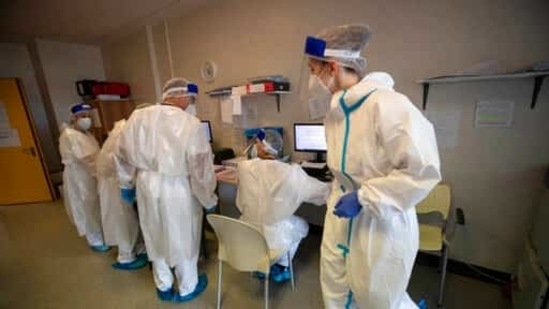 Doctors and nurses work in the emergency Covid-19 ward at the Mellino Mellini hospital in Chiari, northern Italy. (AP) Doctors and nurses work in the emergency Covid-19 ward at the Mellino Mellini hospital in Chiari, northern Italy. (AP)