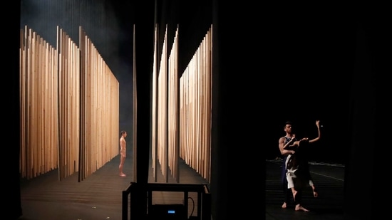 Giannis Mitrakis holding Elpida Skourou, right, and Elena Kekkou, dancers of the Greek National Opera Ballet, perform during a rehearsal of "Despo-Greek Dances" Opera and dance performance in Athens, Friday, Feb. 26, 2021.(AP)