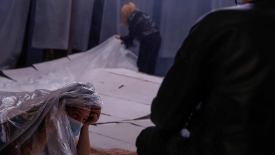 Actor Alexandros Mavropoulos, wearing a face mask listens to the instructions by director Thanos Papakonstantinou during a rehearsal of "The Free Besieged" at the Greek National Theater in Athens, Tuesday, March 2, 2021. (AP)