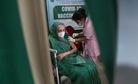 An elderly Indian woman receives COVID-19 vaccine at a private hospital in Guwahati(AP Photo) An elderly Indian woman receives COVID-19 vaccine at a private hospital in Guwahati(AP Photo)