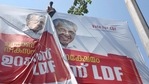 A worker puts up an election campaign banner of Kerala Chief Minister Pinarayi Vijayan, ahead of the Assembly polls, in Kochi, Friday, March 5, 2021. (PTI) A worker puts up an election campaign banner of Kerala Chief Minister Pinarayi Vijayan, ahead of the Assembly polls, in Kochi, Friday, March 5, 2021. (PTI)