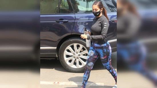The actor completed her attire with a pair of white slides and tied her hair in a tight ponytail to keep them off her face.(Varinder Chawla)
