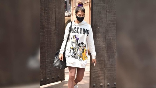 To accessorise the look, she wore a pair of white chunky sneakers and carried a large Louis Vuitton gym bag. Which of these two looks is more of your style?(Varinder Chawla)