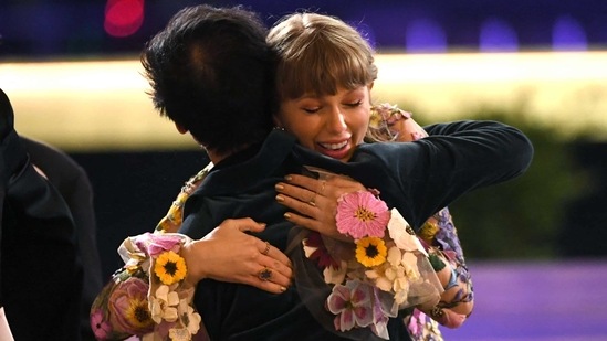 Taylor Swift reacts after being named winner of the Album of the Year award for ‘Folklore’ during the 63rd Annual Grammy Awards Ceremony. Swift, who also found time during the pandemic to make another album and re-record one of her old ones, became the first woman to win the album of the year Grammy for the third time. (Kevin Winter/The Recording Academy/AFP)