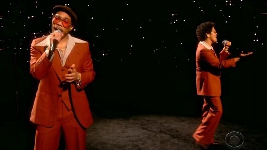 Anderson .Paak (L) and Bruno Mars perform "Leave The Door Open" while opening the In Memoriam segment at the 63rd annual Grammy Awards. During the segment, several notable artists performed songs to honour some of the musicians that were lost over the past year.(CBS/Recording Academy via AP)