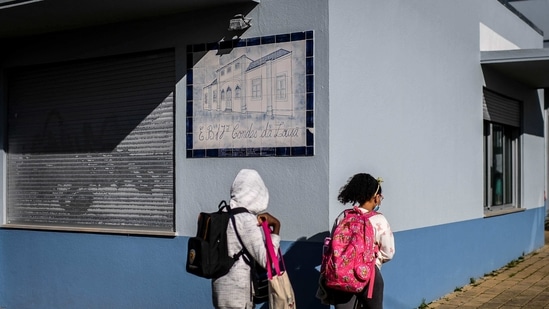 The students from Nursery to Class 5th started attending schools though in a staggered manner to maintain social distancing and avoid crowding. The students and teachers wore masks and used hand sanitisers. (Representative image) (AFP) The students from Nursery to Class 5th started attending schools though in a staggered manner to maintain social distancing and avoid crowding. The students and teachers wore masks and used hand sanitisers. (Representative image) (AFP)