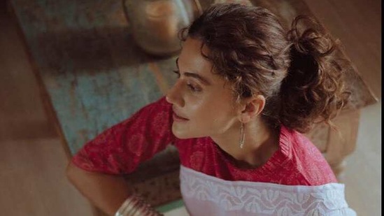 Taapsee shared a the photos on Instagram. She did a full photoshoot at her home in a red blouse and white saree.