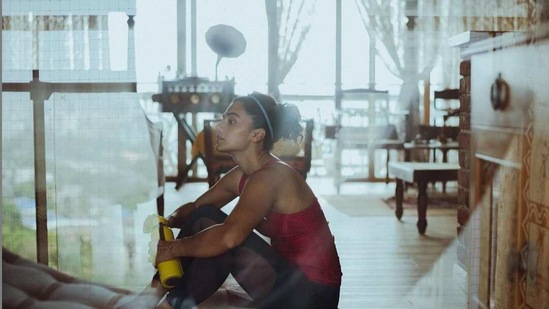 Taapsee taking a rest on her new vinyl floors after a workout session.