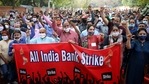 Employees of various banks hold a banner as they shout slogans during a protest against the Privatization of Public Sector Banks and retrograde banking reforms during a two-day Nationwide strike in New Delhi on Tuesday. (ANI Photo) Employees of various banks hold a banner as they shout slogans during a protest against the Privatization of Public Sector Banks and retrograde banking reforms during a two-day Nationwide strike in New Delhi on Tuesday. (ANI Photo)