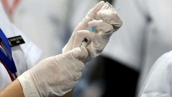 A total of 3,29,47,432 vaccine doses have been administered through 5,55,984 sessions, as per the provisional report till 7 am today, the Health Ministry informed.(Reuters)