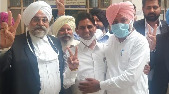 AAP MLA Naresh Yadav, along with Punjab’s leader of opposition Harpal Cheema and counsel Narpal Singh Dhaliwal, coming out of the Sangrur court on Tuesday. (HT PHOTO)