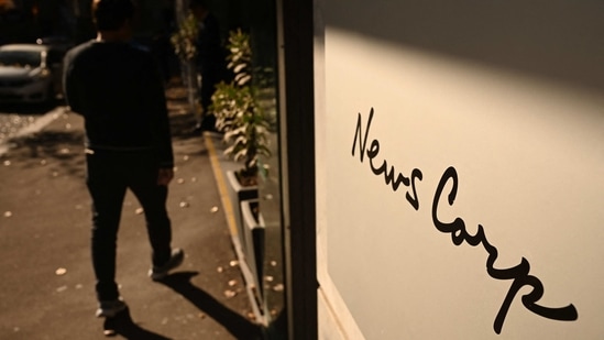 A visitor walks into the headquarters of News Corp Australia in Sydney.(AFP)