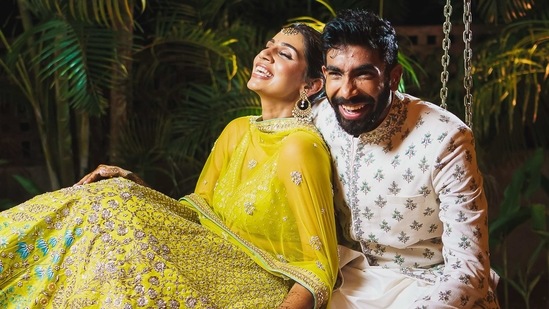 Bumrah and Sanjana Ganesan in Anita Dongre.