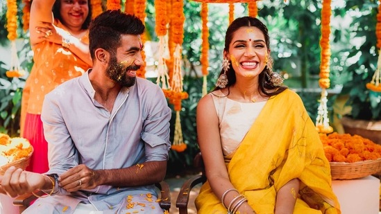 Jasprit Bumrah in Antar-Agni kurta set and Sanjana Ganesan in Anavila sari