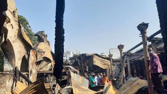 At least 25 shops were gutted in the blaze, an official said. (Rahul Raut/ HT Photo)