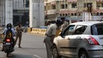 Police personnel check vehicles at CA Road during a week-long lockdown declared after a surge in Covid-19 cases, in Nagpur, on March 15.(HT Photo) Police personnel check vehicles at CA Road during a week-long lockdown declared after a surge in Covid-19 cases, in Nagpur, on March 15.(HT Photo)