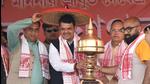 Former Maharashtra CM and BJP leader Devendra Fadnavis being felicitated with an Assamese 'japi' and 'khoria' during an election campaign rally at Borajol in Nalbari district of Assam on March 16. (PTI) Former Maharashtra CM and BJP leader Devendra Fadnavis being felicitated with an Assamese 'japi' and 'khoria' during an election campaign rally at Borajol in Nalbari district of Assam on March 16. (PTI)