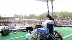 West Bengal CM and TMC supremo Mamata Banerjee, sitting on a wheel-chair, addresses an election campaign rally ahead of state assembly polls, in Bankura. (PTI )