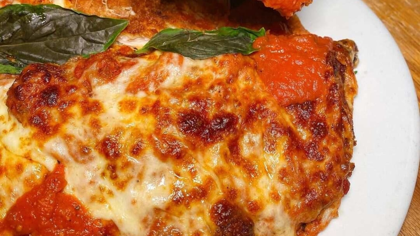 Try out this yummy Italian Chicken Parmigiana recipe oozing with cheesy goodness