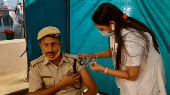 A policeman receives a dose of Covishield, a Covid-19 vaccine manufactured by the Serum Institute of India (SII), at a vaccination centre in Ahmedabad. (Reuters file photo)