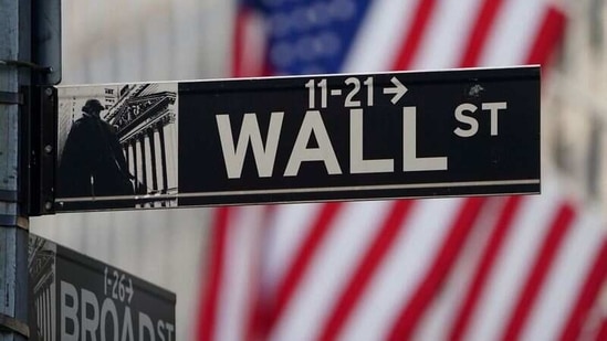 FILE PHOTO: The Wall Street sign is pictured at the New York Stock exchange (NYSE) in the Manhattan borough of New York City, New York, U.S., March 9, 2020. REUTERS/Carlo Allegri(REUTERS)