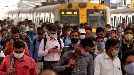 People wearing protective masks walk on a platform at the Chhatrapati Shivaji Terminus railway station, amidst the spread of the coronavirus disease (Covid-19), in Mumbai, India, March 16, 2021. (Reuters)