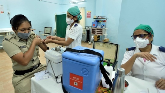 A police personnel being vaccinated against Covid-19, at Rajawadi Hospital, in Mumbai, on March 16. Tope also has requested the Central government to allow 158 more private and public hospitals to set up vaccination centres. Of the 367 hospitals for which the demand was raised, 209 have been given permission, while the remaining are still awaiting the centre’s approval, HT reported.(Satish Bate / HT Photo)