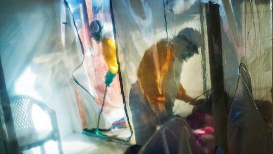 In this Saturday, July 13, 2019 file photo, health workers wearing protective suits tend to an Ebola victim kept in an isolation tent in Beni, Democratic Republic of Congo. (AP Photo/Jerome Delay) In this Saturday, July 13, 2019 file photo, health workers wearing protective suits tend to an Ebola victim kept in an isolation tent in Beni, Democratic Republic of Congo. (AP Photo/Jerome Delay)