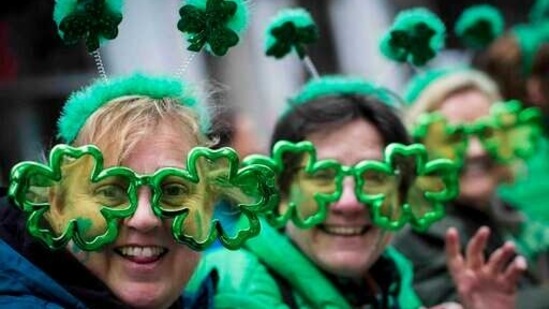 FILE - This file photo from Saturday March 16, 2019, shows Sharon Keely, left, of Dublin, viewing the St. Patrick's Day Parade along Fifth Avenue in New York. A largely virtual St. Patrick's Day is planned for New York City on Wednesday, March 17, 2021, one year after the annual parade celebrating Irish heritage became one of the city's first coronavirus casualties. (AP Photo/Mary Altaffer, File)(AP)