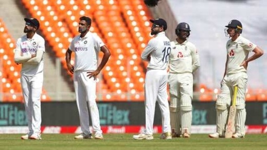 India's Ravichandran Ashwin, second left, and teammates await for third umpire's decision after asking for a review. (AP)