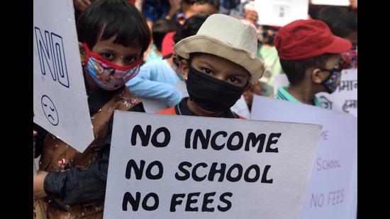 Parents stage a silent protest over the issue of fees during pandemic in Mumbai. (HT FILE) Parents stage a silent protest over the issue of fees during pandemic in Mumbai. (HT FILE)