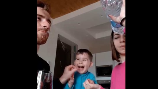 The little boy reacting to his parents' water bottle trick. (Instagram/@ghety____) The little boy reacting to his parents' water bottle trick. (Instagram/@ghety____)