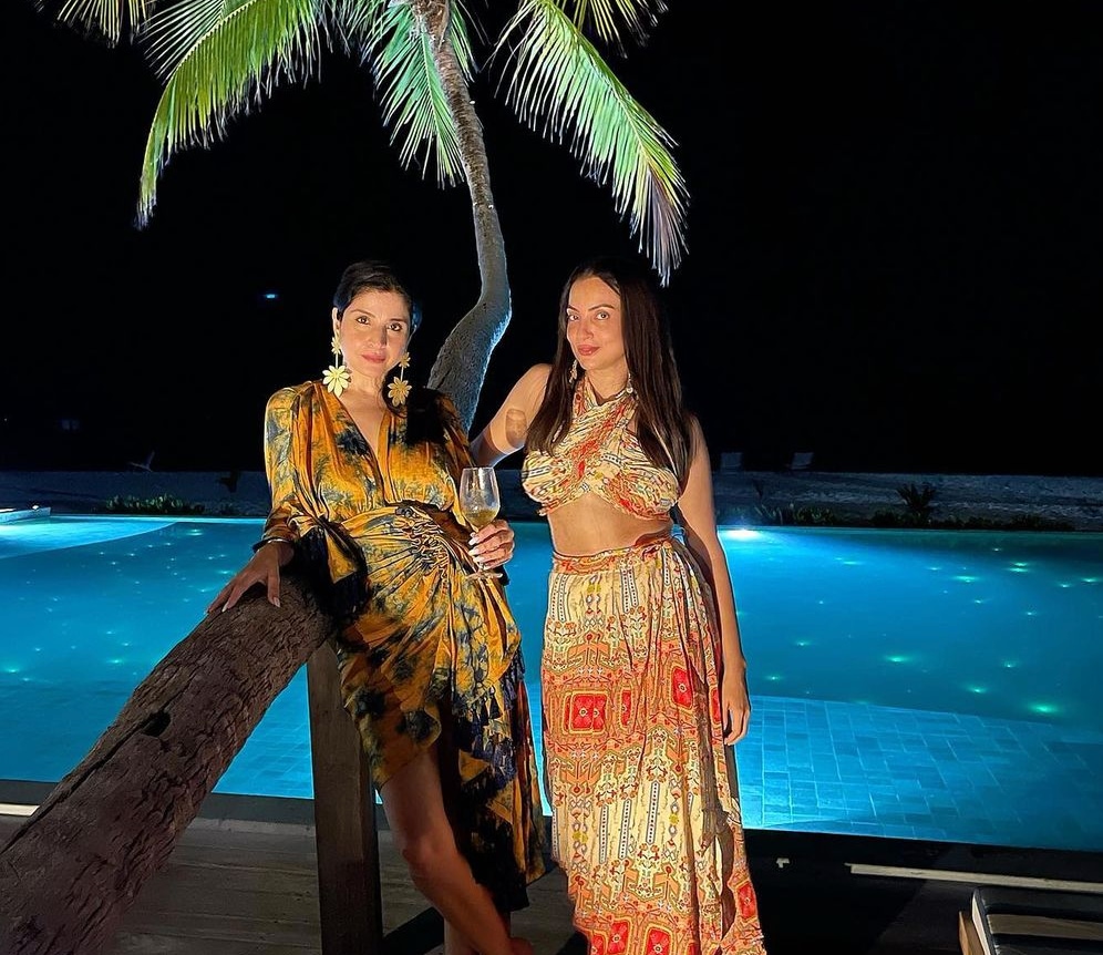 Maheep Kapoor with Seema Khan posing by the pool. Maheep Kapoor with Seema Khan posing by the pool.