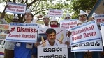 Members of the Aam Adami Party raise slogans against Karnataka Minister Ramesh Jarkiholi for his alleged involvement in CD row in Bengaluru, Wednesday, March 3, 2021. (PTI) Members of the Aam Adami Party raise slogans against Karnataka Minister Ramesh Jarkiholi for his alleged involvement in CD row in Bengaluru, Wednesday, March 3, 2021. (PTI)