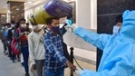 A healthcare worker conducts thermal screening of a passenger at CSMT Railway Station in Mumbai on Wednesday, as Covid-19 cases spike across Maharashtra.(PTI Photo) A healthcare worker conducts thermal screening of a passenger at CSMT Railway Station in Mumbai on Wednesday, as Covid-19 cases spike across Maharashtra.(PTI Photo)
