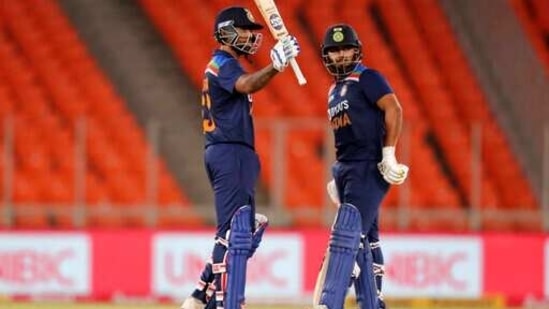 India's Suryakumar Yadav, left, raises his bat to celebrate scoring fifty runs as teammate Rishabh Pant looks on during the fourth Twenty20 cricket match between India and England at Narendra Modi Stadium in Ahmedabad, India, Thursday, March 18, 2021. (AP) India's Suryakumar Yadav, left, raises his bat to celebrate scoring fifty runs as teammate Rishabh Pant looks on during the fourth Twenty20 cricket match between India and England at Narendra Modi Stadium in Ahmedabad, India, Thursday, March 18, 2021. (AP)