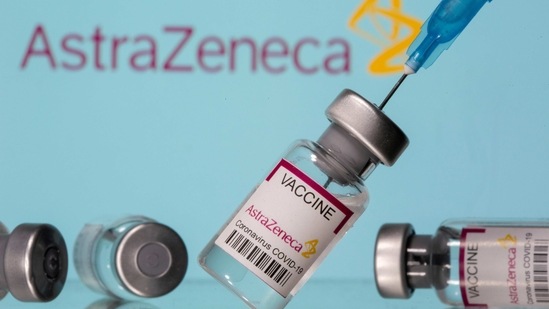 Vials labelled "Astra Zeneca COVID-19 Coronavirus Vaccine" and a syringe are seen in front of a displayed AstraZeneca logo, in this illustration photo taken March 14, 2021. (Reuters)