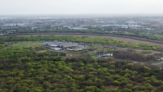 An aerial view of a border fence dividing the cities of Brownsville, Texas and Matamoros, Mexico, on March 15.(Chandan Khanna / AFP )