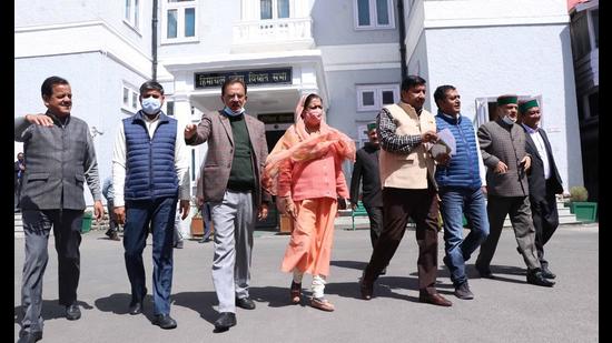 Congress legislators staging a walkout from the Himachal Vidhan Sabha in Shimla on Thursday. (HT Photo) Congress legislators staging a walkout from the Himachal Vidhan Sabha in Shimla on Thursday. (HT Photo)