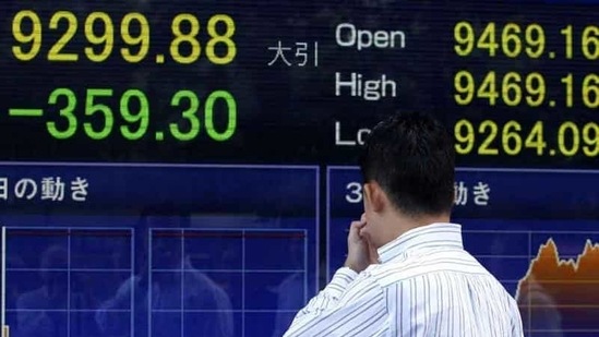 A passerby watches an electronic stock indicator in Tokyo. Asian stock markets tumbled amid fears the US may be heading back into recession and Europe's debt crisis is worsening. The sell-off follows the biggest one-day points decline on Wall Street since the 2008 financial crisis. A passerby watches an electronic stock indicator in Tokyo. Asian stock markets tumbled amid fears the US may be heading back into recession and Europe's debt crisis is worsening. The sell-off follows the biggest one-day points decline on Wall Street since the 2008 financial crisis.